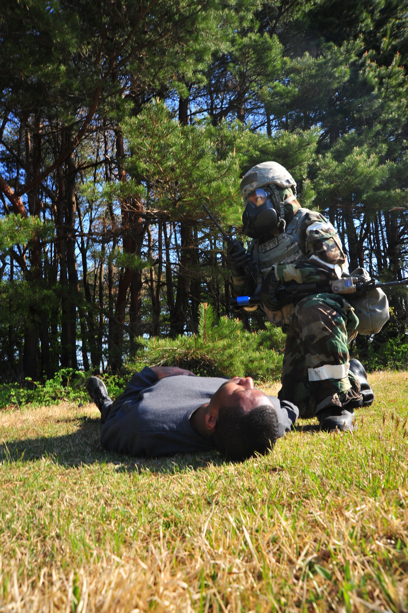 U.S. Air Force Airman 1st Class John Rodil, 35th Security Forces Squadron entry controller, radios for medical assistance after neutralizing a gunman’s attempt to penetrate the flightline’s entry control point during an Operational Readiness Exercise at Misawa Air Base, Japan, May 6, 2014. Following the neutralization of a gunman threat, it is protocol for security forces to notify medical personnel to assess the health status of the individual. (U.S. Air Force photo/Senior Airman Jose Hernandez-Domitilo)