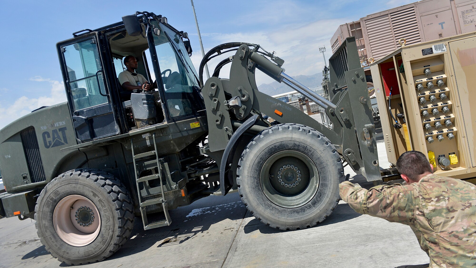 Staff Sgt. Marcin Vande Hei, 455th Expeditionary Logistics Readiness Squadron Central Command Materiel Recovery Element non-commissioned officer-in-charge guides a forklift May 2, 2014 at Bagram Airfield, Afghanistan.  Vande Hei, is part of a CMRE team that is responsible for identifying, storing and redeploying assets to the U.S. or disposing of items located throughout the region. The CMRE team has helped recover more than 60 pieces of equipment worth about $1.66 million within the last eight months. Vande Hei is a native of Washington, D.C. and is deployed from Langley Air Force Base, Va. (U.S. Air Force by Staff Sgt. Evelyn Chavez/Released)