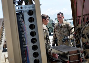 Staff Sgt. Marcin Vande Hei, 455th Expeditionary Logistics Readiness Squadron Central Command Materiel Recovery Element non-commissioned officer-in-charge identifies a piece of equipment May 2, 2014 at Bagram Airfield, Afghanistan.  As part of a CMRE team, Vande Hei is responsible for identifying, storing and redeploying assets to the U.S. or disposing of items located throughout the region. The CMRE team has helped recover more than 60 pieces of equipment worth about $1.66 million within the last eight months. Vande Hei is a native of Washington, D.C. and is deployed from Langley Air Force Base, Va. (U.S. Air Force by Staff Sgt. Evelyn Chavez/Released)