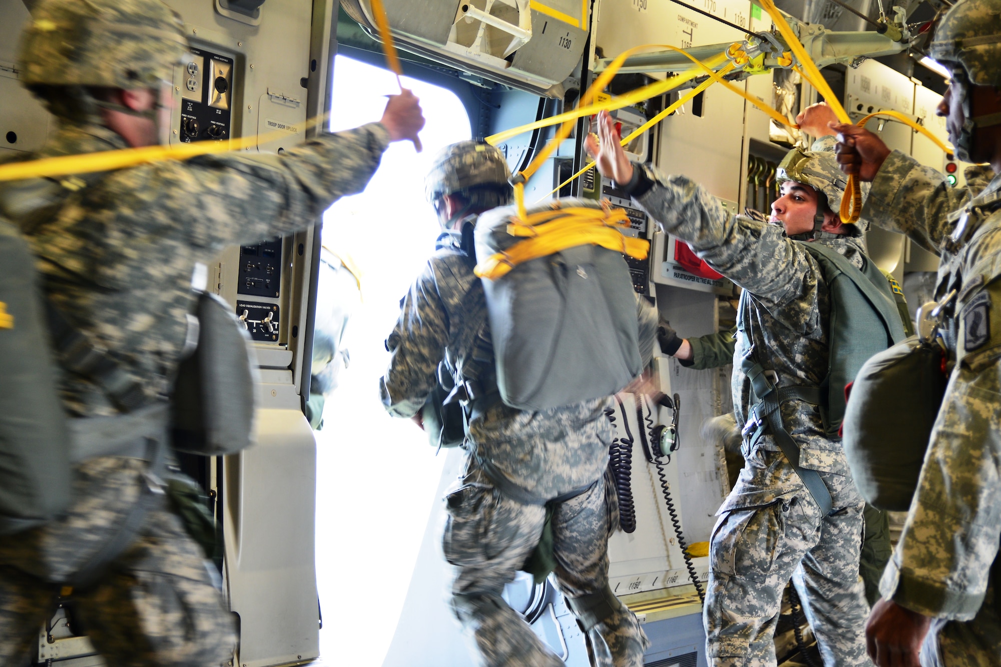 A US paratrooper exits SAC 02 through the side troop door over Ziemsko drop zone during the second airdrop flight of May 3. (Courtesy photo: HAW / Ville Tuokko)