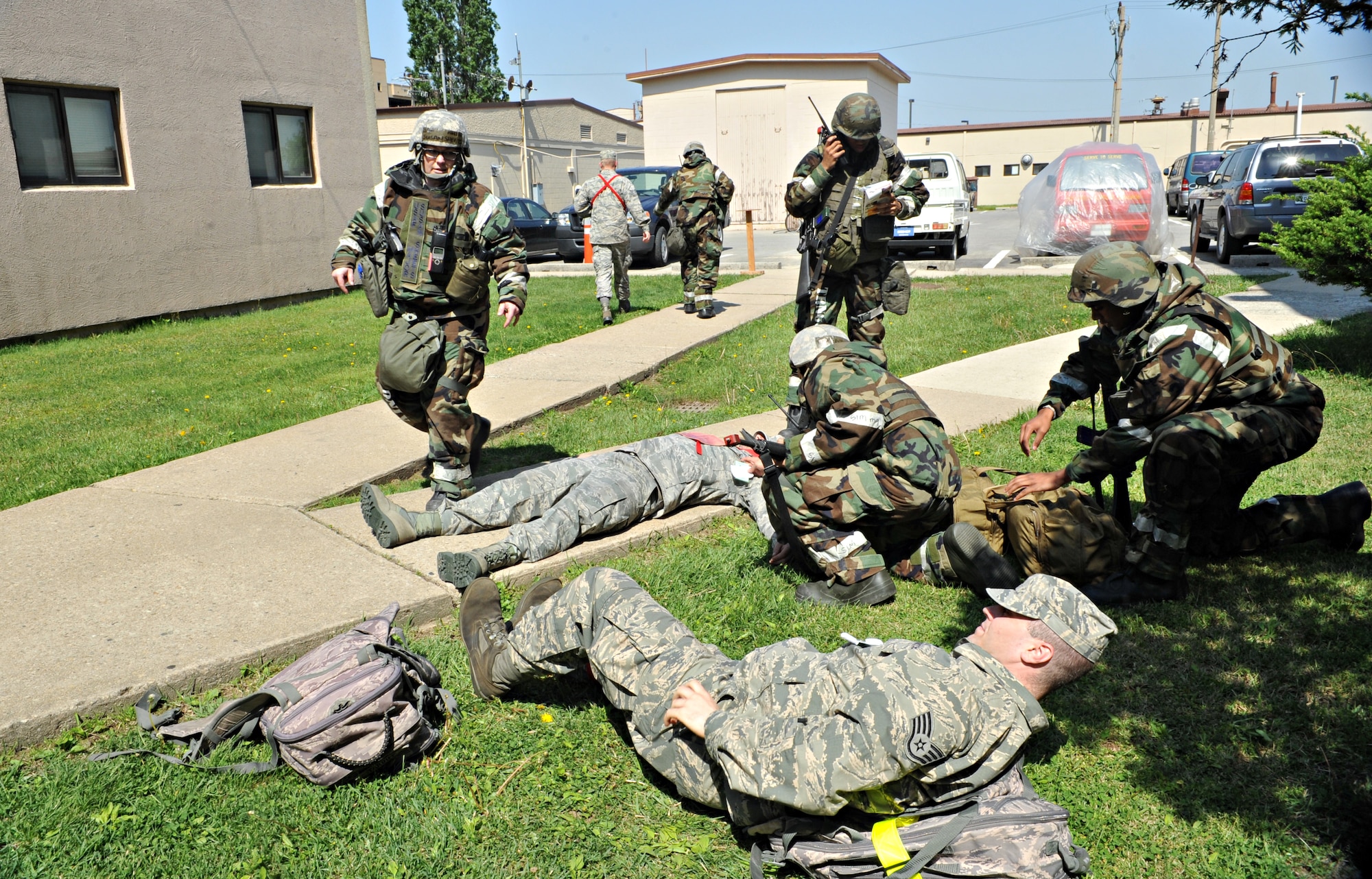Post-attack reconnaissance teams triage mock casualties after attacks on Bldg. 938 during Operational Readiness Exercise Beverly Bulldog 14-02 at Osan Air Base, Republic of Korea, May 6, 2014. The scenario required the PAR teams to communicate effectively with each other and facilitate self-aid and buddy care for simulated injuries. (U.S. Air Force photo/Airman 1st Class Ashley J. Thum)