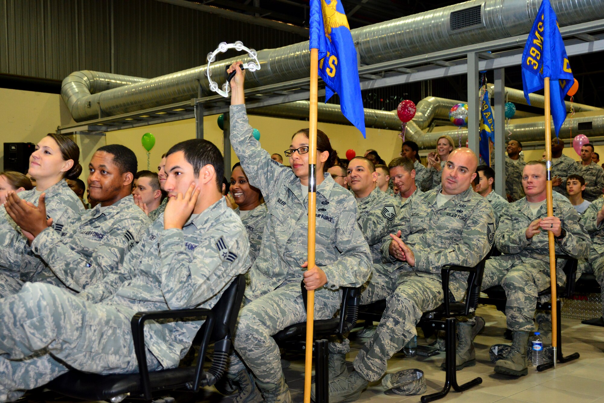 Master Sgt. Kimberly Guler, 39th Air Base Wing Equal Opportunity
director, shakes a tambourine while cheering with other members of the 39th
ABW during the inspection outbrief May 5, 2014, Incirlik Air Base, Turkey.
Members of the United States Air Forces in Europe Inspector General team
visited Incirlik AB April 26 - May 5 to inspect the wing on one of its core
missions. (U.S. Air Force photo by Staff Sgt. Eric Summers Jr./Released)
