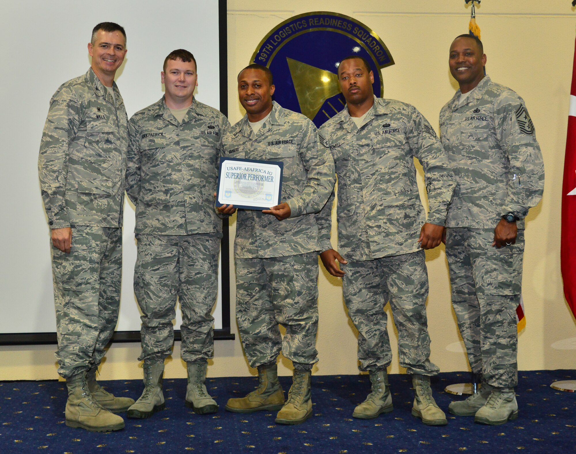 Members of the 39th Communications Squadron Quality Assurance work
center receive an award for Superior Team Performer from Col. Craig Wills,
39th Air Base Wing commander, and Chief Master Sgt. Anthony Johnson, 39th
ABW command chief, during an inspection outbrief May 5, 2014, Incirlik Air
Base, Turkey. The wing received a total of two United States Air Forces in
Europe Inspector General awards, 16 superior performer awards and eight team
awards. (U.S. Air Force photo by Staff Sgt. Eric Summers Jr./Released)
