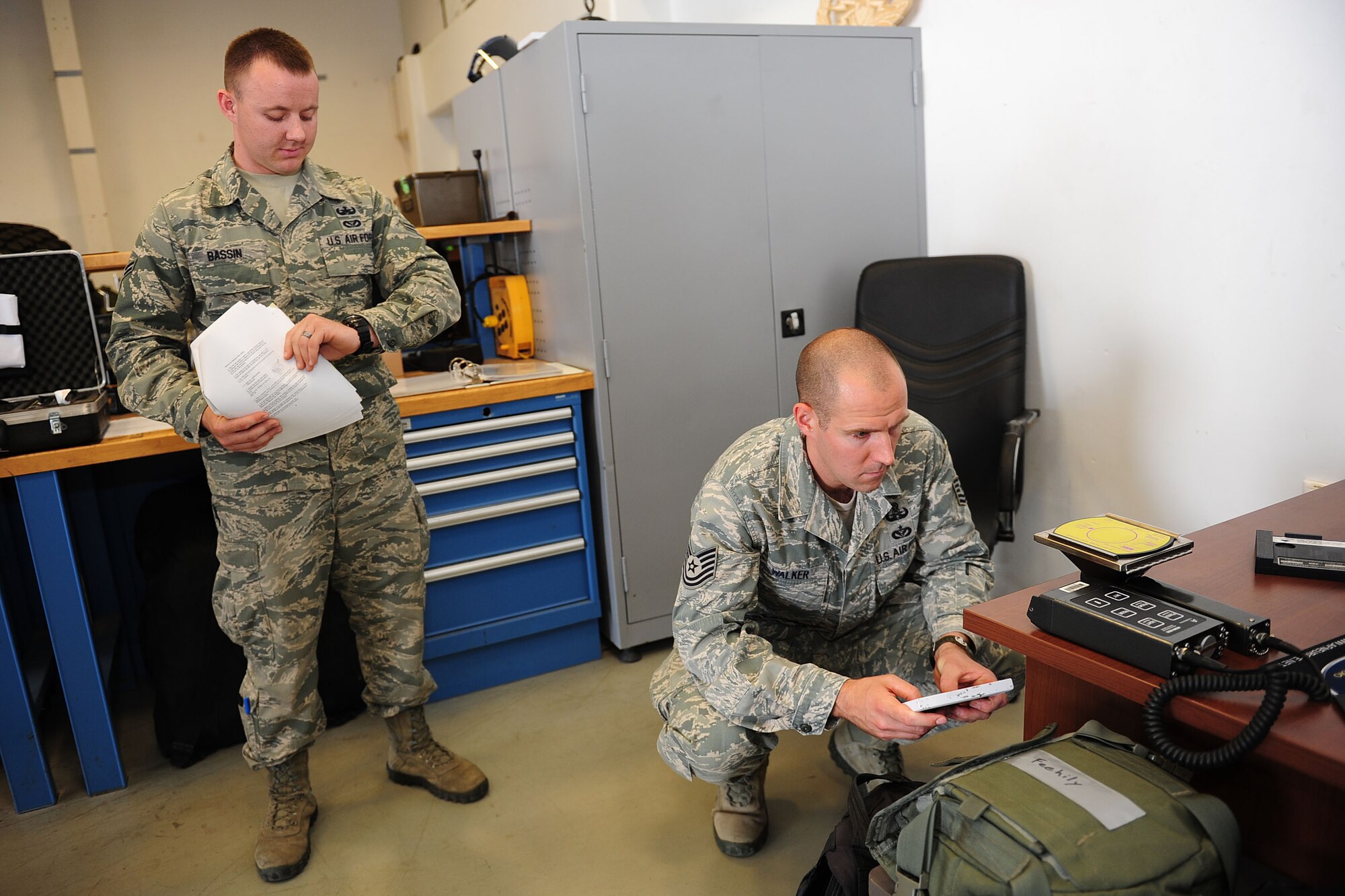 Airman 1st Class Samuel Bassin and Tech Sgt. Mark Walker, both 39th Civil Engineer Squadron explosive ordnance disposal technicians, test radiation monitoring equipment May 2, 2014, Incirlik Air Base, Turkey.  Inspectors from the United States Air Forces in Europe inspector general team visited the base to conduct an 11-day inspection which evaluates Incirlik's ability to manage priority-level resources in accordance with approved safety, security and reliability standards. (U.S. Air Force photo by Senior Airman Nicole Sikorski/Released) 

