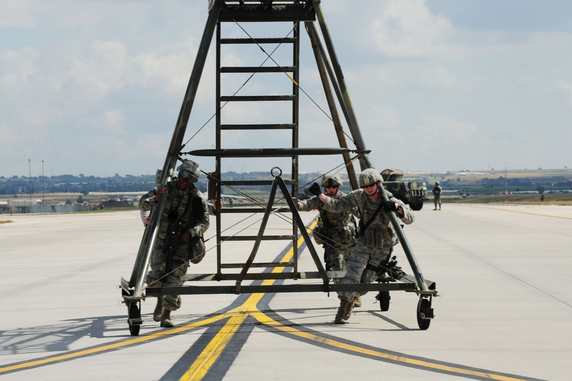 Airmen assigned to the 39th Security Forces Squadron prepare for a readiness inspection May 1, 2014, Incirlik Air Base, Turkey.  Inspectors from the United States Air Forces in Europe inspector general team visited the base to conduct an 11-day inspection which evaluates the 39th Air Base Wing’s ability to manage priority-level resources in accordance with approved safety, security and reliability standards.  (U.S. Air Force photo illustration by Senior Airman Nicole Sikorski/Released) 