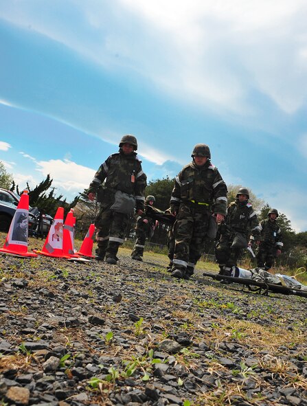 Airmen assigned to the 35th Medical Group carry a simulated patient onto a medical transport vehicle during an Operational Readiness Exercise at Misawa Air Base, Japan, May 5, 2014. More than eight simulated patients were medically evacuated to the 35th MDG for treatment. (U.S. Air Force photo/Senior Airman Jose L. Hernandez-Domitilo)