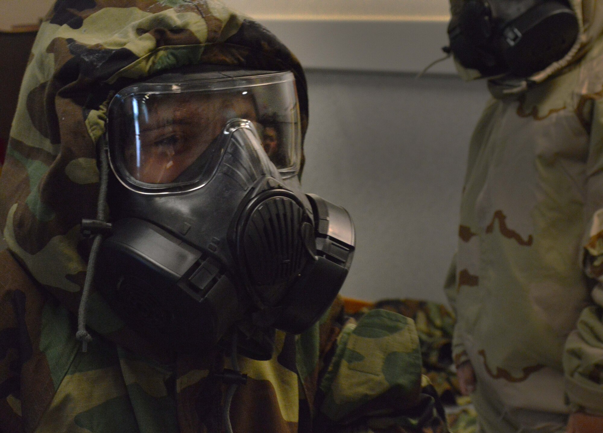 Alyssa Giampapa, Aviano Elementary School 1st grader, tries on individual protective equipment during a mock deployment, May 2, 2014, at Aviano Air Base. Students received a briefing on the importance of IPE after they tried on different combat gear to include flack vests and helmets. (U.S. Air Force photo/Senior Airman Kristine MacDonald)