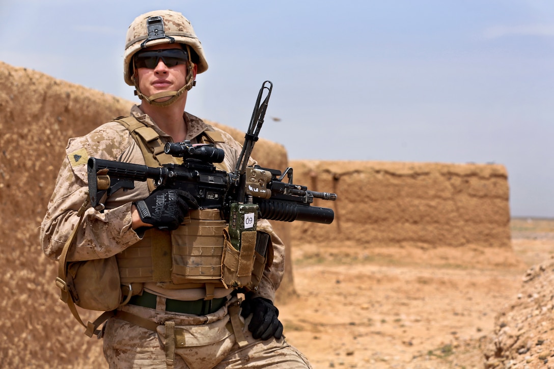 U.S. Marine Corps Cpl. Eric McGovern provides security during a patrol in Helmand province, Afghanistan, April 12, 2014. McGovern, a fire team leader, is assigned to Weapons Company, 1st Battalion, 9th Marine Regiment. The Marines patrolled to maintain a security presence in their area of operations.  