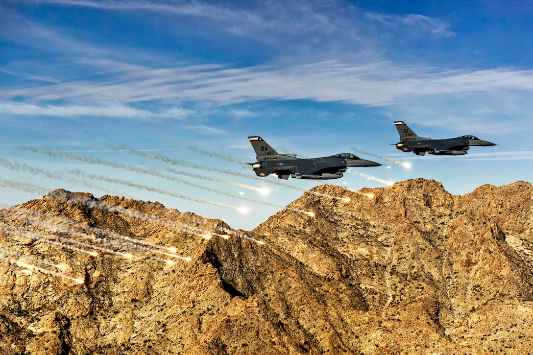 Air Force student pilots flying F-16C Fighting Falcons release flares during Coronet Cactus near Davis-Monthan Air Force Base, Ariz., April 10, 2014. The annual exercise provides student fighter pilots with realistic training, including air-to-air combat and dropping inert and live ordnance. 