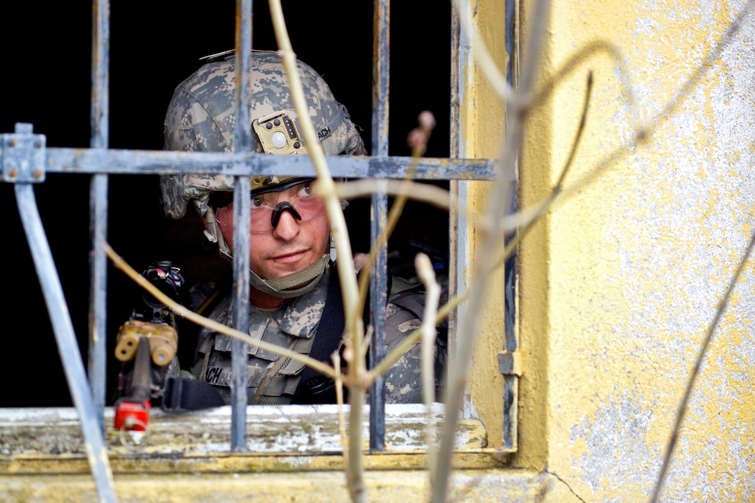 U.S. Army Sgt. Emerson Beach provides security during infantry training near Osoppo, Italy, April 8, 2014. Beach is a paratrooper assigned to Company C, 2nd Battalion, 503rd Infantry Regiment, 173rd Infantry Brigade Combat Team.  