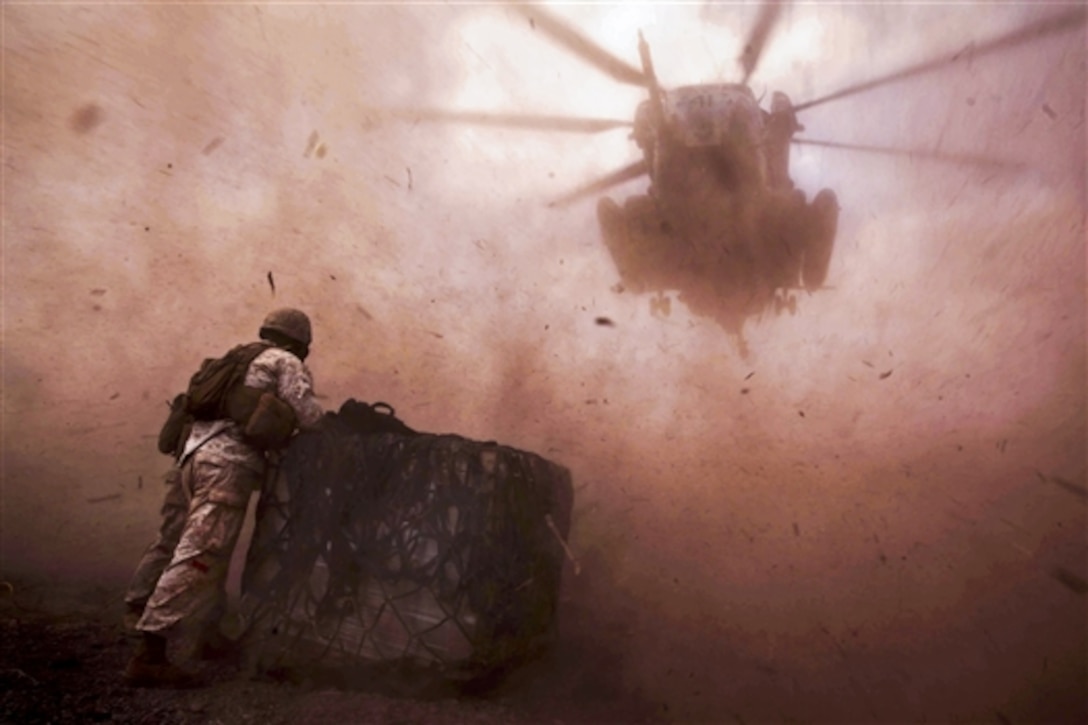 U.S. Marines await a CH-53E Super Stallion helicopter for a helicopter during a U.S.-France bilateral exercise in Djibouti, April 25, 2014. The Marines, assigned to Combat Logistics Battalion 22, 22nd Marine Expeditionary Unit, are deployed with the Bataan Amphibious Ready Group as a theater reserve and crisis response force throughout the U.S. Central Command and U.S. 5th Fleet areas of responsibility.  