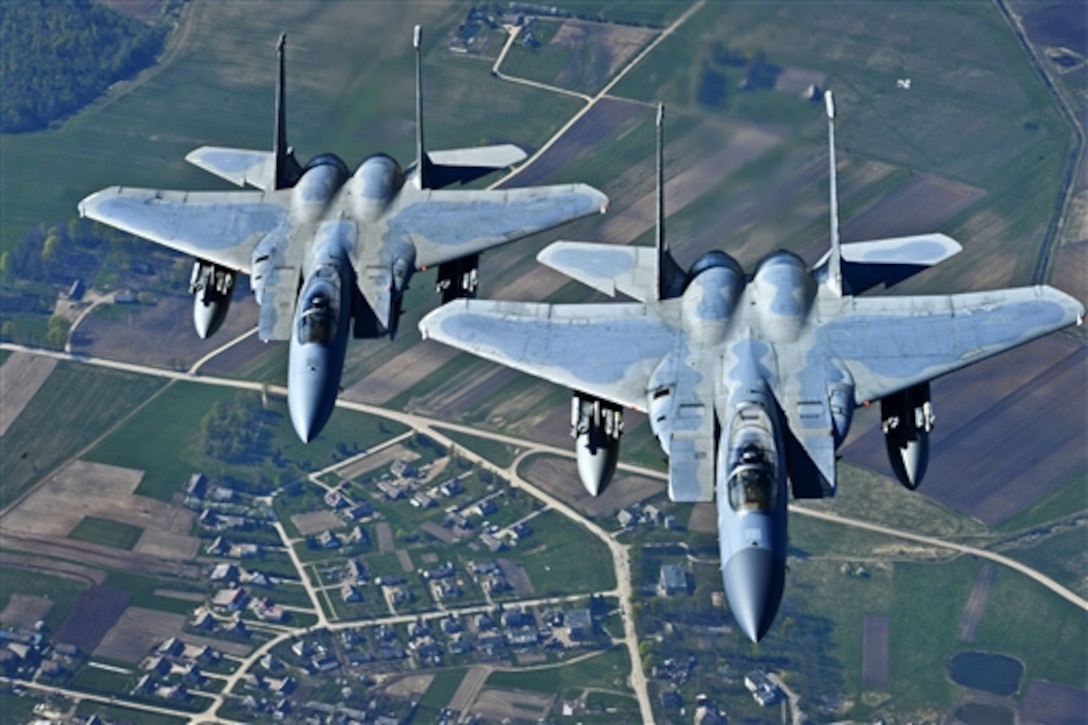 Air Force Maj. Barak Amundson and Air Force 1st Lt. Matthew Scott fly over Lithuania during a training mission with the Lithuanian air force, April 23, 2014. Amundson and Scott, pilots, are assigned to the 493rd Expeditionary Fighter Squadron, which conducted the Baltic Air Policing mission since January and will be handing over the mission to the Polish air force. 