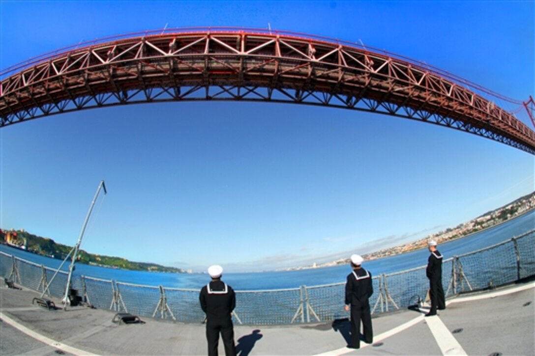 U.S. sailors man the rails while pulling into Lisbon, Portugal, April 28, 2014, aboard the USS Mount Whitney to kick off the NATO exercise Trident Jaguar. The sailors are assigned to the Ghostriders of Helicopter Sea Combat Squadron 28, Detachment 1.  