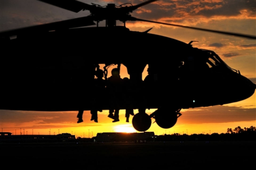 Mississippi Army National Guard Soldiers conduct fast-rope training as part of Operation Emerald Warrior at the Combat Readiness Training Center, Gulfport, Miss., April 30, 2014. The multinational, joint force training exercise ensures the units are prepared for any state emergency or combat mission. Soldiers are assigned to 1st Battalion, 185th Aviation Regiment, and 2nd Battalion, 20th Special Forces Group.  