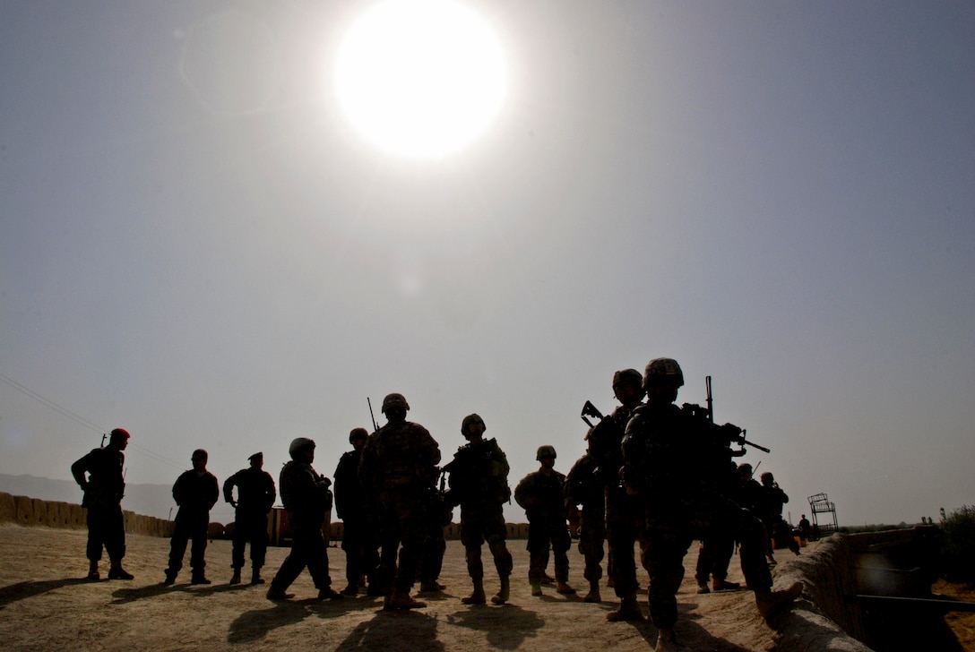 The sun bears down of Guam Army National Guardsmen and Afghan soldiers at Qala-I-Jangi in northern Afghanistan's Balkh province, Sept. 30, 2013. This facility once served as a camp for prisoners of war and became a historic site in the early stages of Operation Enduring Freedom. Qala-I-Jangi was also a former Taliban base.  
