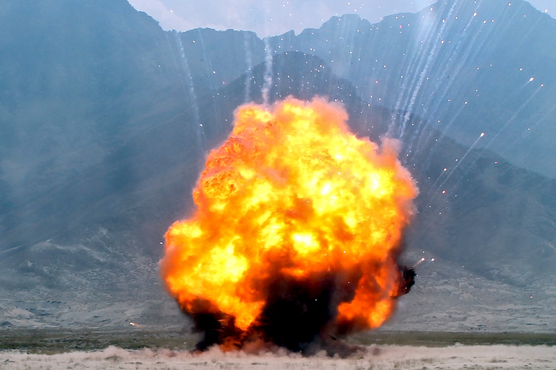 A fireball erupts as U.S. troops detonate more than 600 pounds of explosives on a range near Bagram Airfield, Afghanistan, Sept. 30, 2013. A three-person U.S. Army explosive ordnance disposal team destroyed old, recovered and captured munitions during the operation. The team, assigned to Combined Joint Task Force Paladin-East's 663rd Ordnance Company, was supported by U.S. Air Force security forces airmen.  
