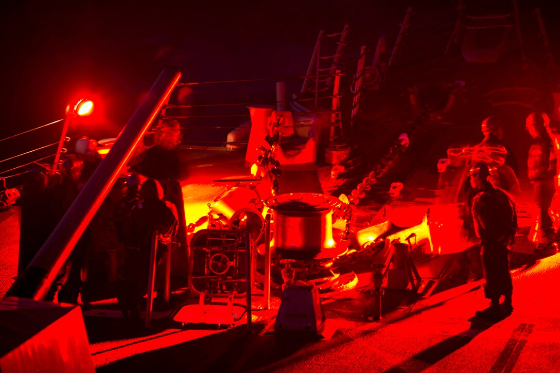 U.S. sailors prepare for a sea-and-anchor detail aboard the guided missile destroyer USS Mustin on patrol with the George Washington Carrier Strike Group in the U.S. 7th fleet area of responsibility, Oct. 2, 2013. The group is supporting security and stability in the Indo-Asia-Pacific region.  

