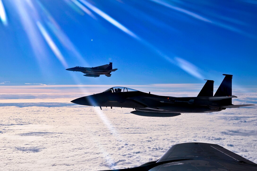 Two F-15C Eagles prepare to return to their simulated air combat portion of the Arctic Challenge exercise over Norway, Sept. 20, 2013. The pilots are assigned to the 48th Fighter Wing. Six nations participated in the exercise to boost interoperability between NATO, the United States, the United Kingdom and members of the Nordic Defense Cooperation.  
