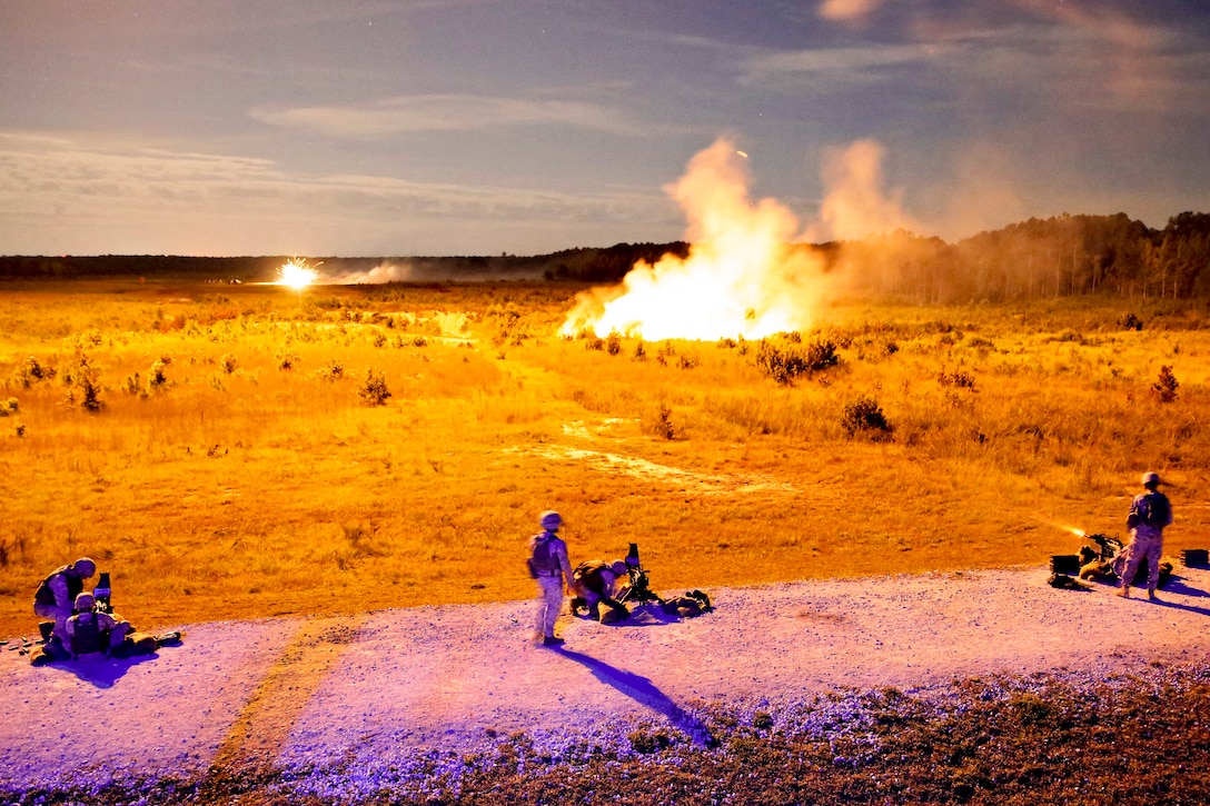 Marines fire Mk. 19 grenade launchers as part of a grenade training exercise at night on Camp Lejeune, N.C., Sept. 17, 2013. The Marines, assigned to Bridge Company, 8th Engineer Support Battalion, 2nd Marine Logistics Group, waited for illumination flares to light the range before firing on targets. 
