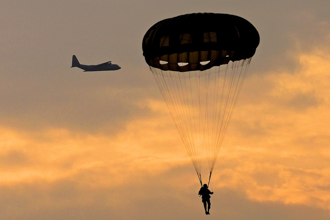 A U.S. paratrooper conducts airborne operations from a U.S. Air Force C-130 Hercules over Hopfenohe Drop Zone at the 7th Army Joint Multinational Training Command's Grafenwoehr Training Area, Germany, Sept. 25, 2013. The paratroopers are assigned to Special Operations Command Africa.  

