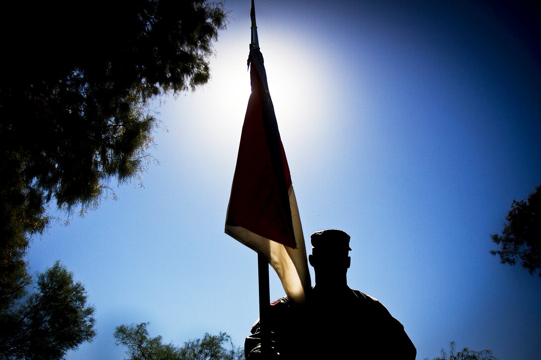 A soldier stands before a change-of-command ceremony on Fort Irwin, Calif., Sept. 20, 2013. The soldier is assigned to the 2nd Squadron, 11th Armored Cavalry Regiment.  
