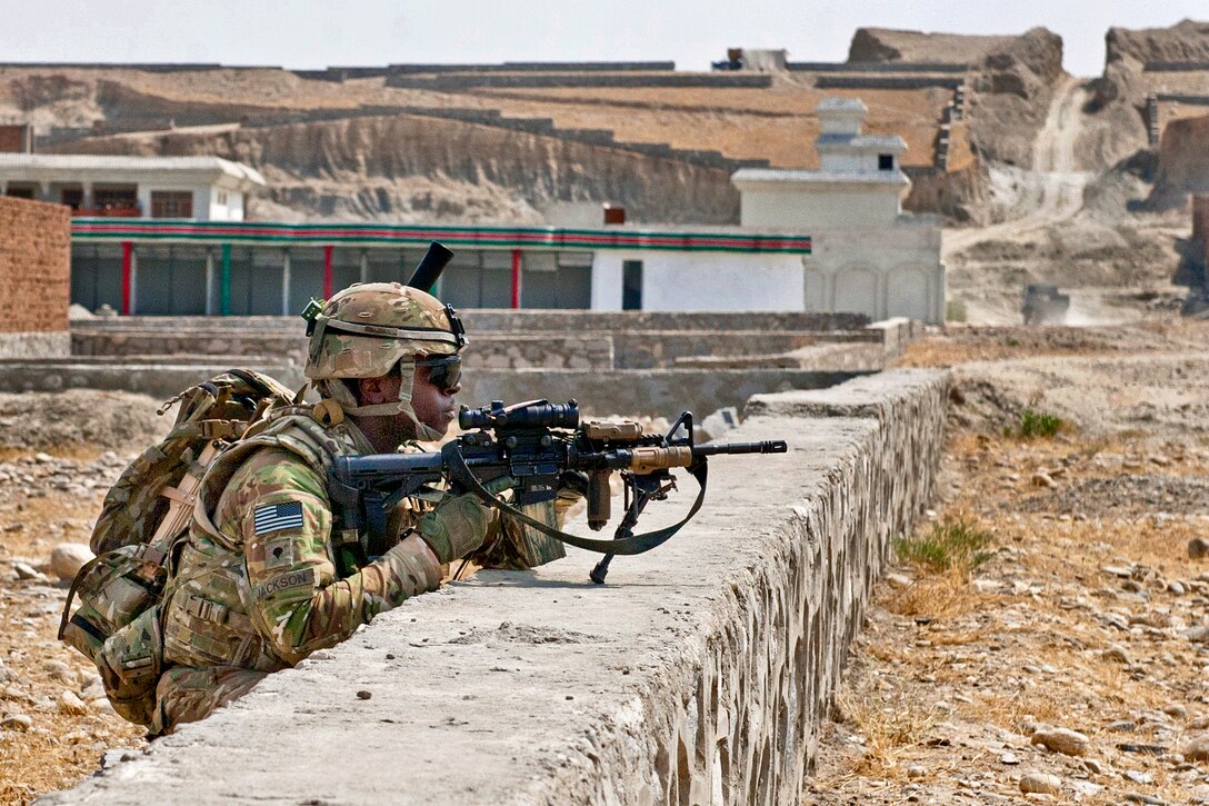 U.S. Army Spc. Kevin Jackson provides security during a reconnaissance mission in a village south of Forward Operating Base Fenty in Afghanistan's Nangarhar province, Sept. 8, 2013. Jackson is assigned to the 1st Cavalry Division's 4th Squadron, 9th Cavalry Regiment, 2nd Armored Brigade Combat Team.  
