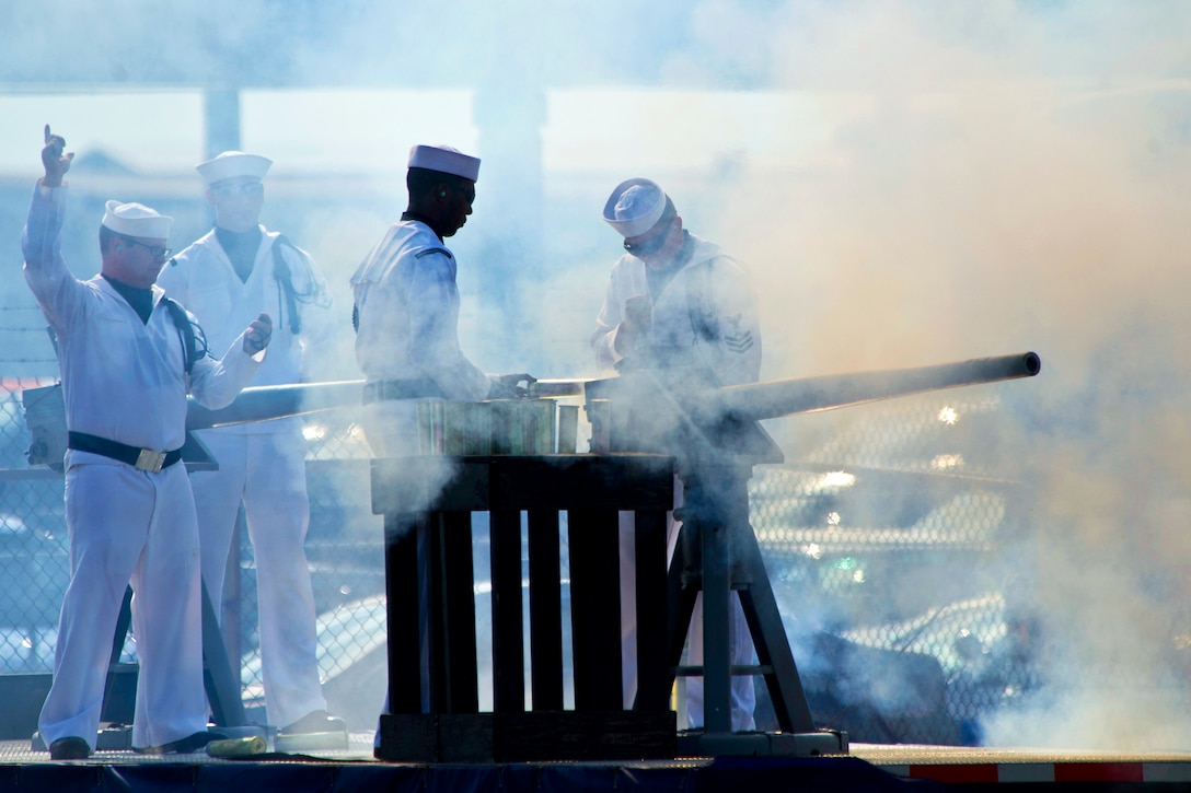 Sailors render a gun salute during the commissioning ceremony for the USS Minnesota in Norfolk, Va., Sept. 7, 2013. The submarine's name honors the residents of the state and their continued support of the nation's military. The sailors are assigned to the submarine.  
