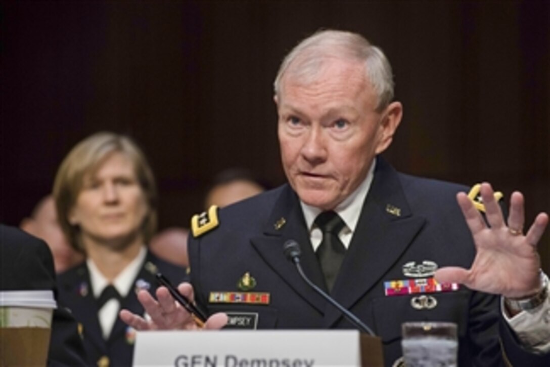 Army Gen. Martin E. Dempsey, right, chairman of the Joint Chiefs of Staff, testifies before the Senate Armed Services Committee in Washington, D.C., May 6, 2014. 