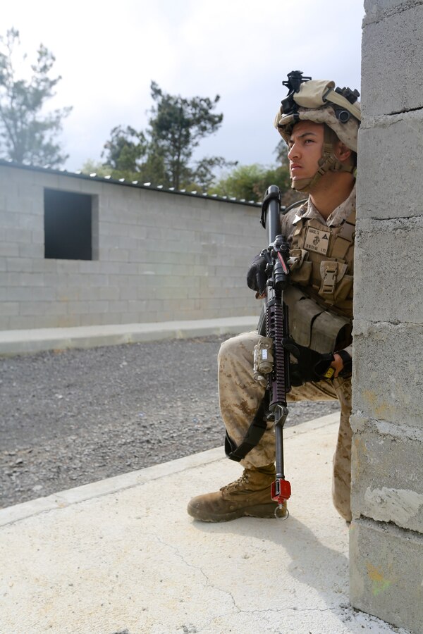 U.S. Marine Corps Lance Cpl. Tyler Hammond, a rifleman with Special-Purpose Marine Air-Ground Task Force Crisis Response defends a simulated embassy during bilateral training with soldiers from the Spanish Army Light Infantry Battalion on Asturias, Spain, April 28, 2014. The training was conducted to further partnership and interoperability between SP-MAGTF CR and the Spanish forces. (U.S. Marine Corps photo by Lance Cpl. Alexander Hill/Released)
