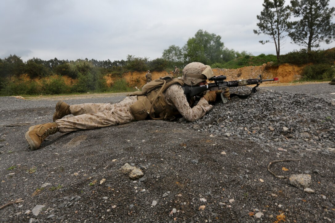 U.S. Marine Corps Lance Cpl. Tyler Hammond, a rifleman with Special-Purpose Marine Air-Ground Task Force Crisis Response readies his weapon during bilateral training with soldiers from the Spanish Army Light Infantry Battalion on Asturias, Spain, April 28, 2014. The training was conducted to further partnership and interoperability between SP-MAGTF CR and the Spanish forces. (U.S. Marine Corps photo by Lance Cpl. Alexander Hill/Released)
