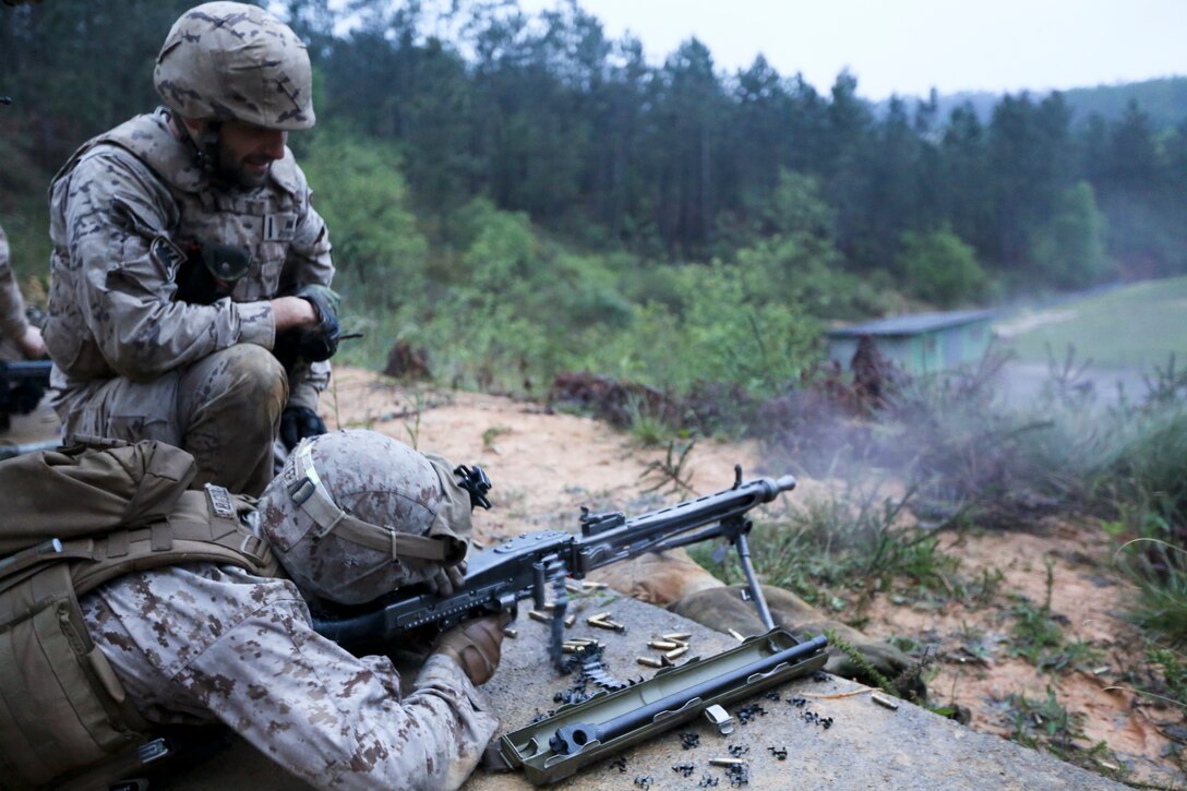 U.S. Marine Corps Lance Cpl. Jered Bass, a machine gunner with Special-Purpose Marine Air-Ground Task Force Crisis Response, fires an array of light machine guns with soldiers from the Spanish Army Light Infantry Battalion as part of a bilateral training exercise on Asturias, Spain, April 29, 2014. The training  was conducted to further partnership and interoperability between SP-MAGTF CR and the Spanish forces. (U.S. Marine Corps photo by Lance Cpl. Alexander Hill/Released)
