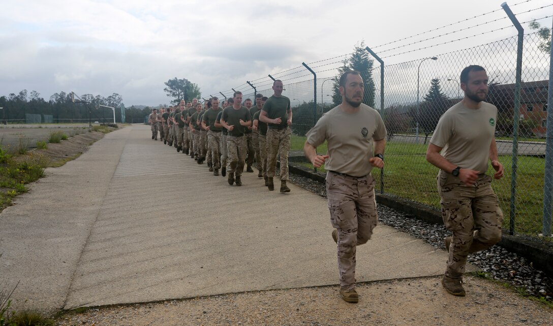 U.S. Marines of Special-Purpose Marine Air-Ground Task Force Crisis Response run with soldiers from the Spanish Army Light Infantry Battalion on Asturias, Spain, May 5, 2014. The Marines trained alongside the Spanish Army as part of bilateral training that was conducted to further partnership and interoperability between SP-MAGTF CR and the Spanish forces. (U.S. Marine Corps photo by Lance Cpl. Alexander Hill/Released)
