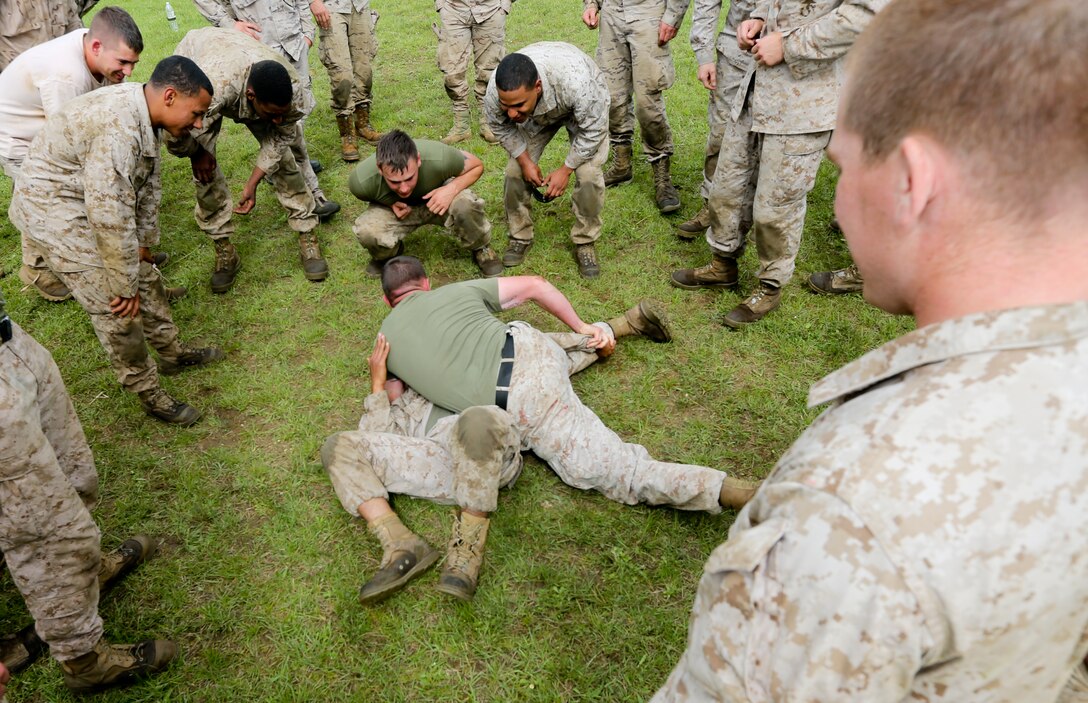 U.S. Marines of Special-Purpose Marine Air-Ground Task Force Crisis Response demonstrate techniques from the Marine Corps Martial Arts Program to the Spanish Army Light Infantry Battalion during bilateral training on Asturias, Spain, May 5, 2014. The training was conducted to further partnership and interoperability between SP-MAGTF CR and the Spanish forces. (U.S. Marine Corps photo by Lance Cpl. Alexander Hill/Released)
