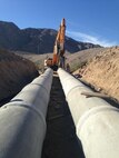 Marines with 8th Engineer Support Battalion, 2nd Marine Logistics Group build a cement culvert during a two-month project with Joint Task Force North in El Centro, Calif., March - April, 2014. The project gave service members the opportunity to use skills they learned in the military while also helping to improve border patrol's access to the area by opening the route to more than just all-terrain vehicles.
