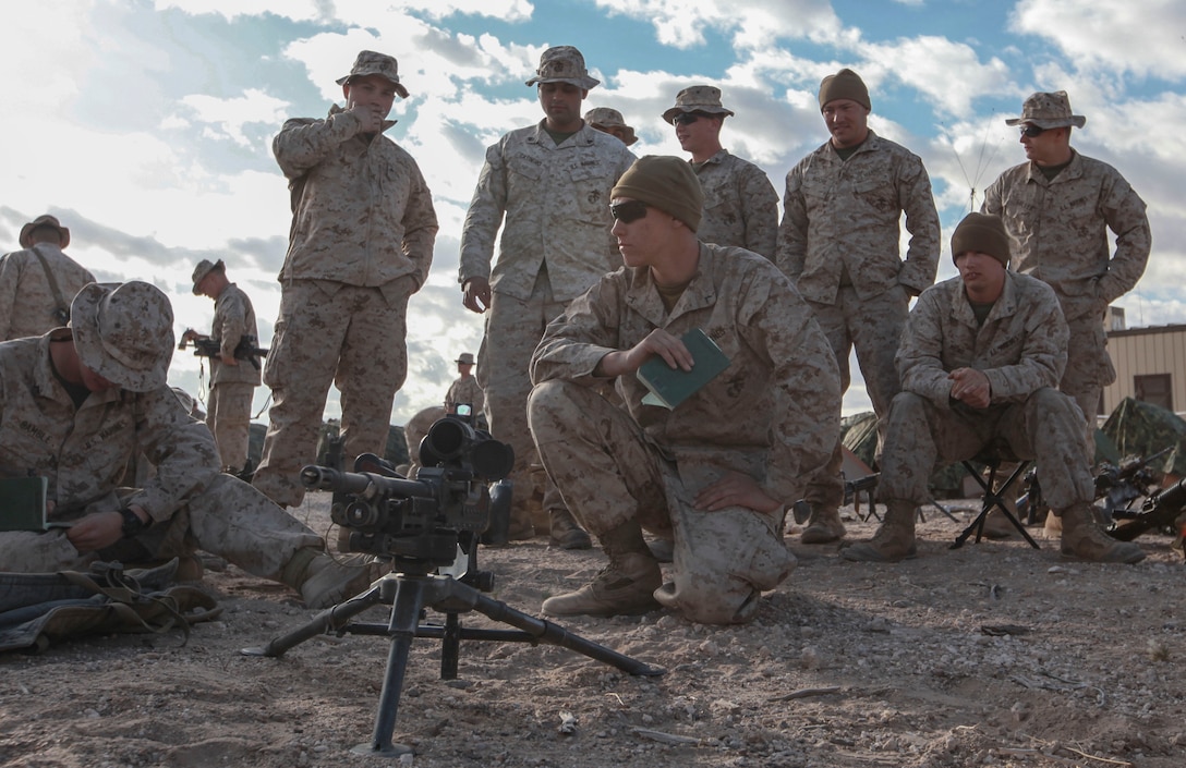 Reading, Penn., native Pfc. Cody Troxel, a machine gunner with Echo Company, 2nd Battalion, 8th Marine Regiment, 2nd Marine Division, gives a class on the M240 Bravo machine gun to Marines from 3rd Platoon while waiting to train at Range 62, on Fort Bliss, Texas, April 5, 2014.
