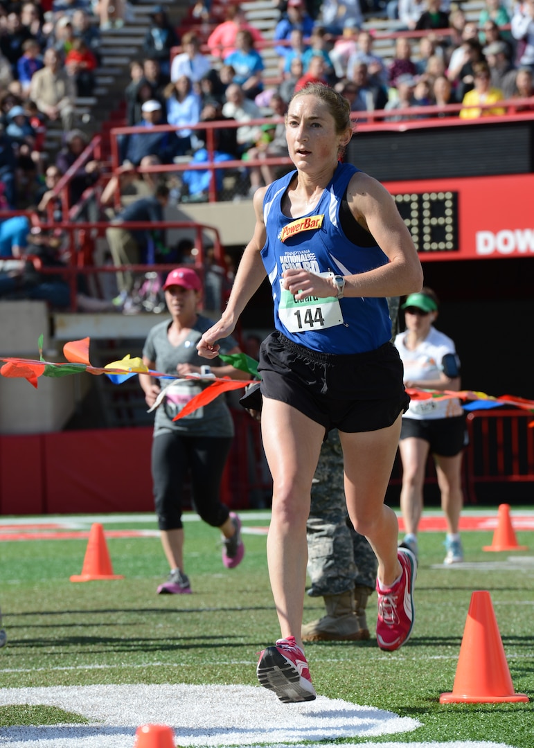 Senior Airman Emily Shertzer, an oboist with the Pennsylvania Air National Guard, completes the final steps of the 2014 Lincoln National Guard Marathon in Lincoln, Neb., May 4,2014. Shertzer made history when she won the marathon’s overall women’s division with a time of 2 hours, 50 minutes, 36 seconds.