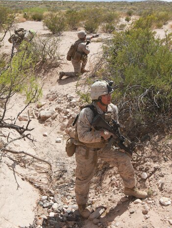 Marines with Echo Company, 2nd Battalion, 8th Marine Regiment, provide security during a training exercise at Range 62, on Fort Bliss, Texas, April 5, 2014. Marines attacked an objective as a squad covering more than 800 meters during one of the first training exercises conducted by America’s Battalion since arriving in Texas.