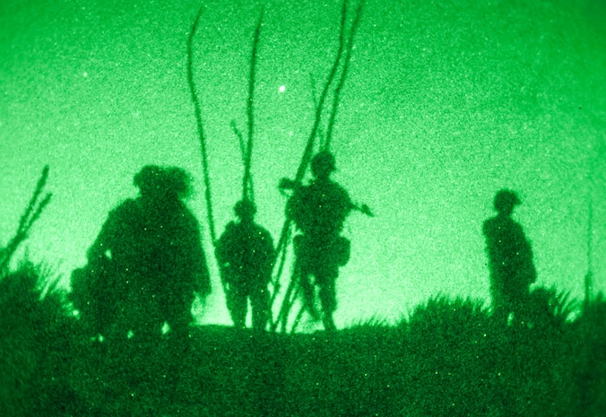 Marines with Fox Company, 2nd Battalion, 8th Marine Regiment, 2nd Marine Division, move under the cover of darkness during a training assault exercise on a village at Fort Bliss, Texas, April 28, 2014. Marines moved into position under the cover of night over tough terrain to conduct an assault on the village in order to eliminate enemy forces occupying it. The village was key to future operations in the area and allowed control of Route Grey, a main route for coalition operations in the area.