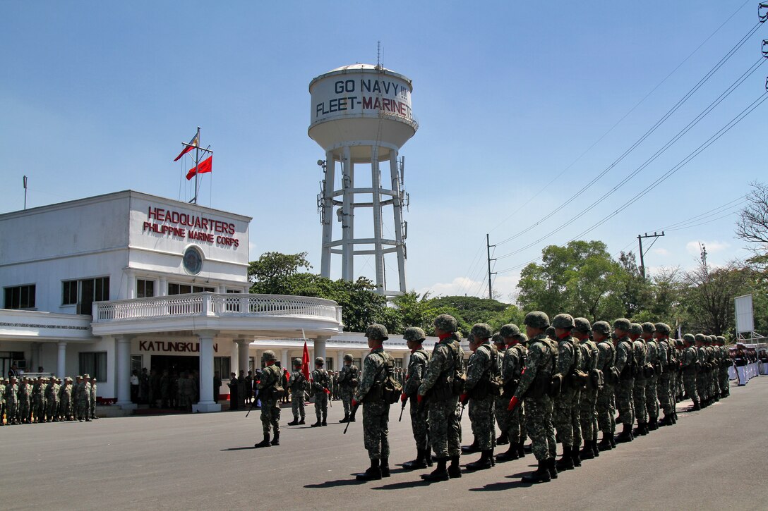 Philippine marines stand in formation during a welcome ceremony for Lt. Gen. Terry G Robling, commander of U.S. Marine Corps Forces, Pacific, at Naval Station Jose Francisco in Manila, Philippines May 7, 2014.  Robling visited the base during Balikatan 2014. This year marks the 30th iteration of the exercise, which is an annual Republic of the Philippines-U.S. military bilateral training exercise and humanitarian civic assistance engagement. 