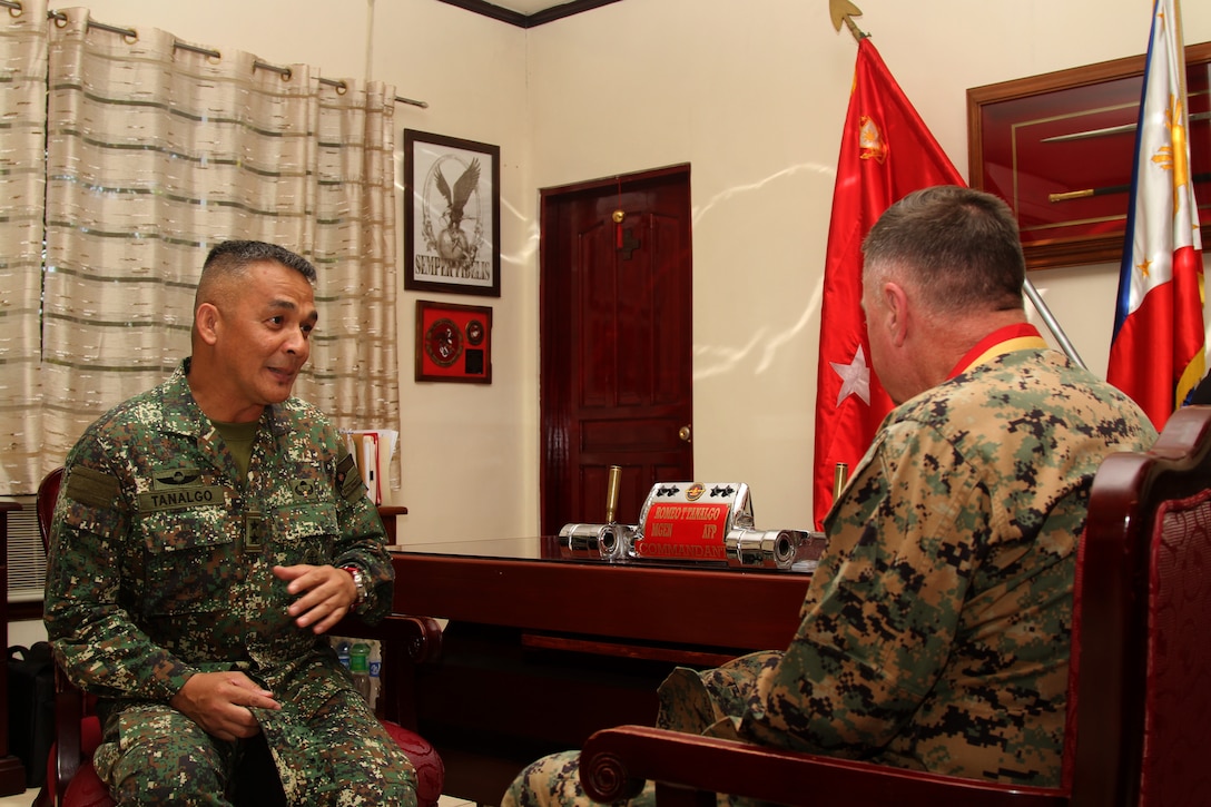 Philippine Marine Corps Commandant, Major General Romeo Tanalgo, speaks to  Lt. Gen. Terry G Robling, commander of U.S. Marine Corps Forces, Pacific, at Naval Station Jose Francisco in Manila, Philippines May 7, 2014.  Robling visited the base during Balikatan 2014. This year marks the 30th iteration of the exercise, which is an annual Republic of the Philippines-U.S. military bilateral training exercise and humanitarian civic assistance engagement.