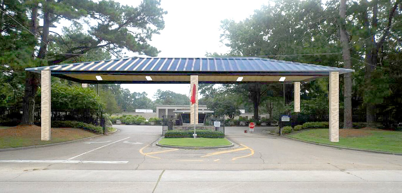 This artist rendering shows six columns for the under construction main gate shelter, while the finished overhead protective cover will be supported by two additional middle columns for a total of eight.