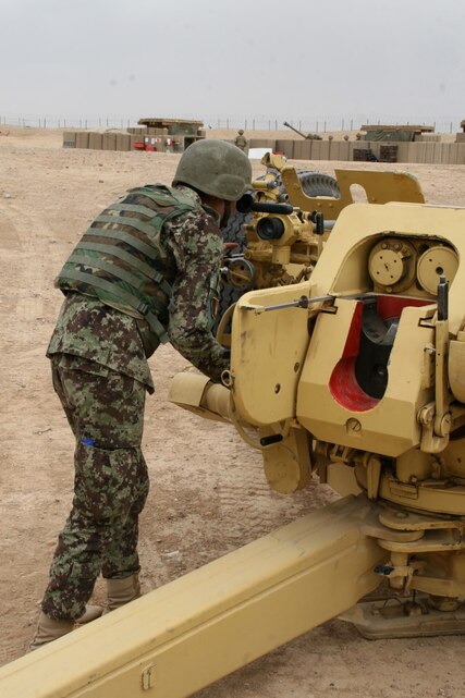 An Afghan National Army soldier with the 215th Corps carefully makes adjustments to the D-30 122 mm howitzer during training aboard Camp Bastion, Helmand province, Afghanistan, May 7, 2014. The training is part of a six-week course taught at the Regional Corps Battle School that gives Afghan instructors the opportunity to train their fellow soldiers on the howitzer weapons system.