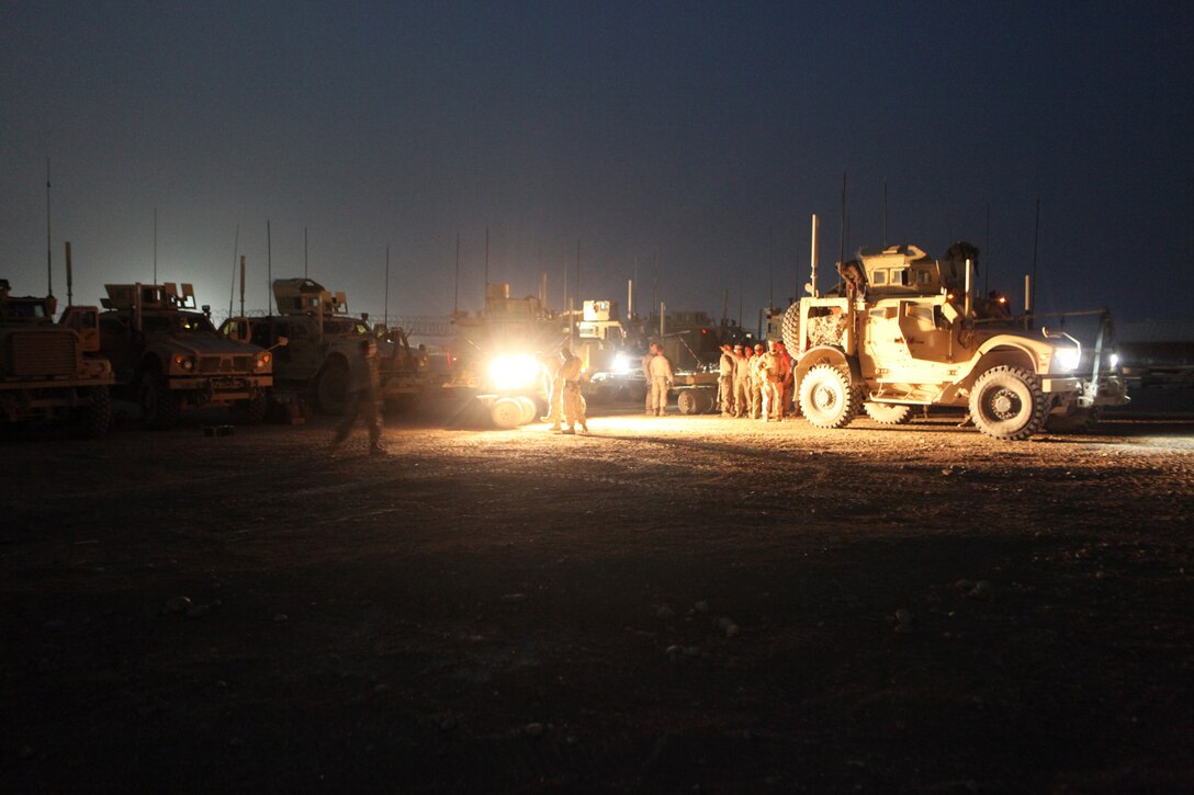 Marines and sailors with Security Force Assistance Advisor Team 2-215 arrive at Camp Leatherneck, Helmand province, Afghanistan, May 5, 2014. The service members with SFAAT 2-215 are completing a seven-month deployment as the last advisors in support of the 2nd Brigade, 215th Corps, Afghan National Army.