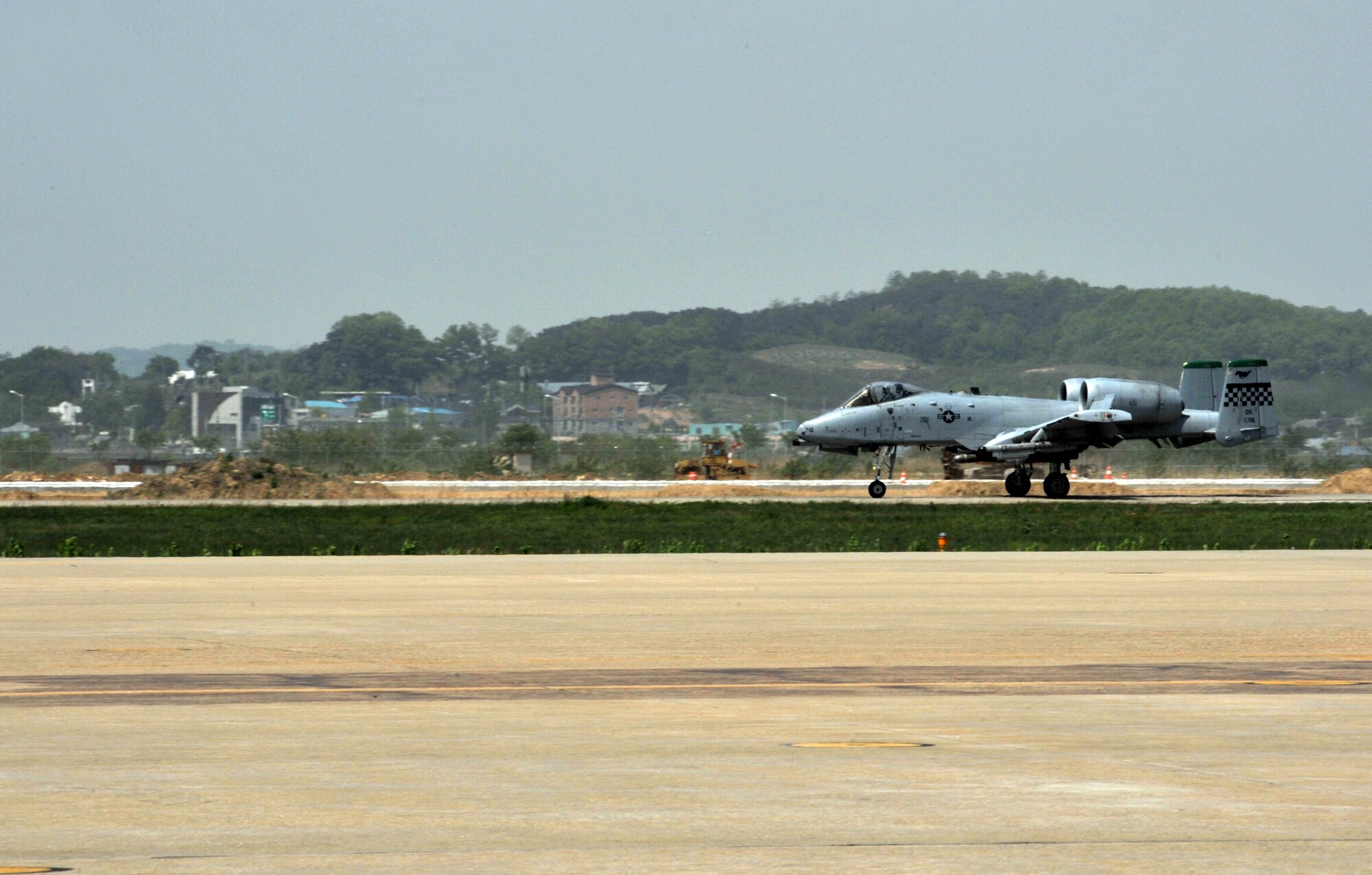 An A-10 Thunderbolt II from the 25th Fighter Squadron taxis toward its hardened aircraft shelter after a training sortie during Operational Readiness Exercise Beverly Bulldog 14-02 at Osan Air Base, Republic of Korea, May 7, 2014. Pilots use training sorties during OREs to help reach their minimum number of flying hours to maintain their combat mission ready status. (U.S. Air Force photo/Airman 1st Class Ashley J. Thum)