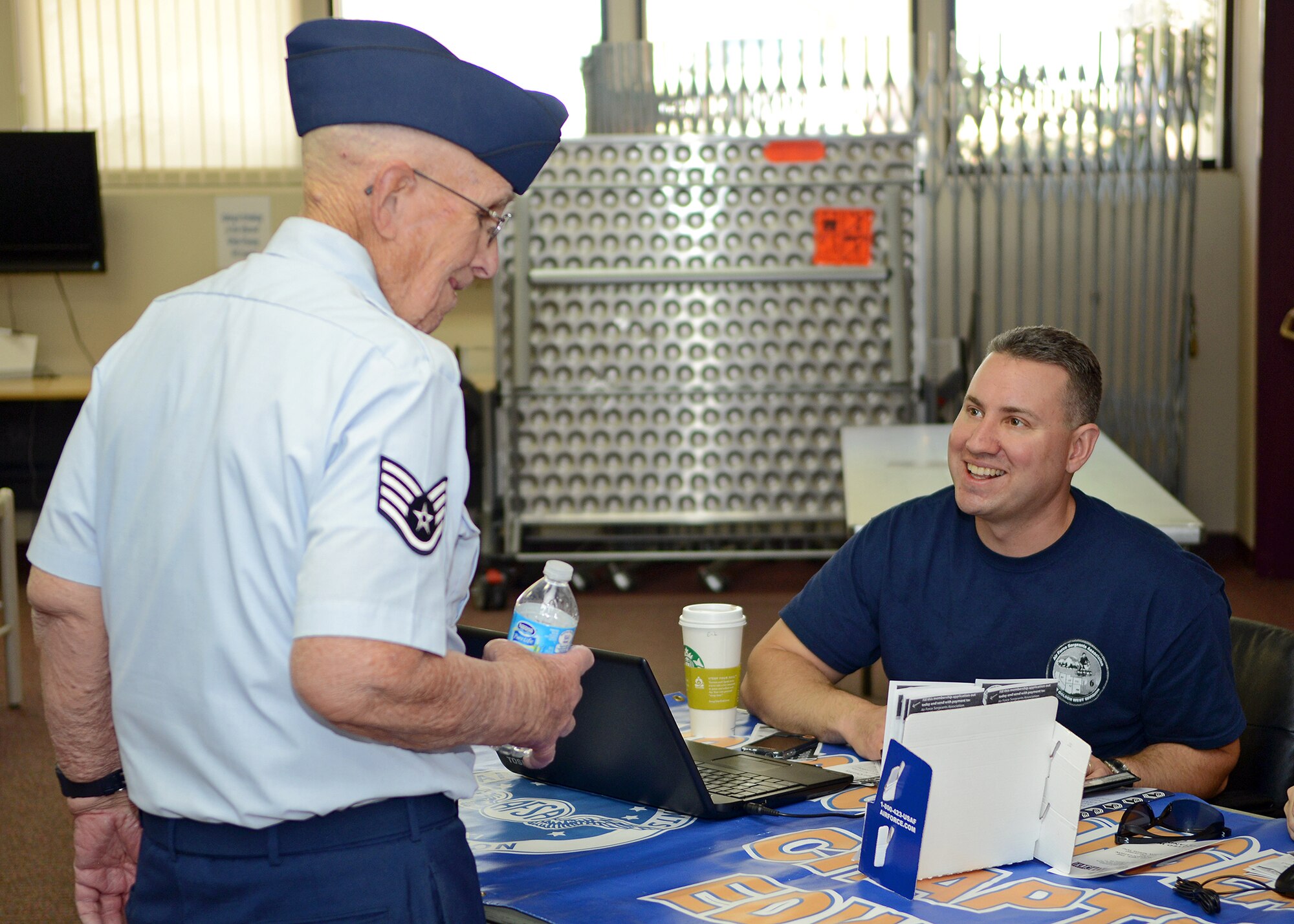 Master Sgt. Erik Robbins (right), 412th Force Support Squadron base career assistance advisor speaks with (ret.) Air Force Staff Sgt. Thomas White during the 2014 Retiree Appreciation Day May 3 at the Oasis Community Center. Robbins is the Air Force Sergeants Association, Chapter 1328, president who had a booth during the event. (U.S. Air Force photo by Jet Fabara)