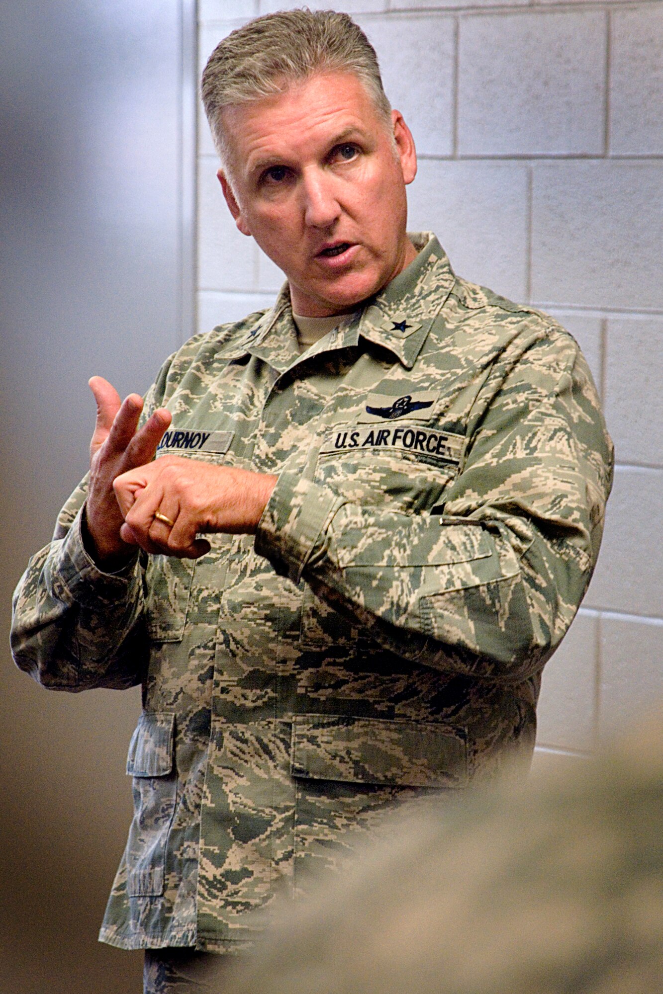 Brig. Gen. John C. Flournoy, Jr., 4th Air Force commander, makes a point as he addresses members of the 49th Aerial Port Flight during a visit to Grissom Air Reserve Base, Ind., April 12, 2014. Flournoy spent four days touring the base and meeting the men and women who support its mission. (U.S. Air Force photo/Tech. Sgt. Douglas Hays)