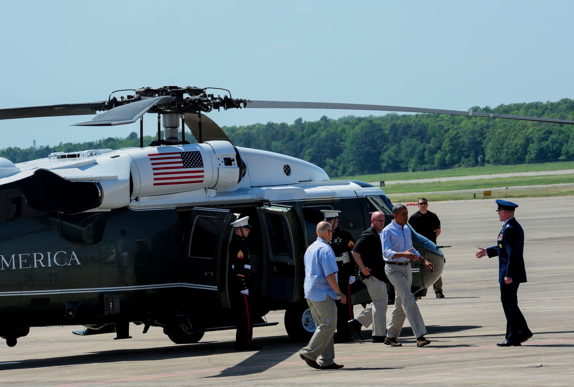 Col. Patrick Rhatigan, 19th Airlift Wing and installation commander, greets President Barack Obama as he steps off Marine One May 7, 2014, at Little Rock Air Force Base, Ark. The president visited communities affected by the April 27 tornado and returned to the base prior to his departure from the state. (U.S. Air Force photo by Senior Airman Kaylee Clark)
