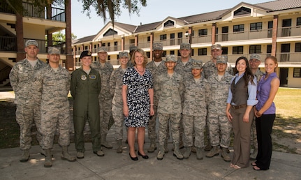 Secretary of the Air Force Deborah Lee James (middle) stands with Joint Base Charleston Airmen May 6, 2014, at the dorms on JB Charleston, S.C. James is the 23rd Secretary of the Air Force and was appointed to the position Dec, 20, 2013. She is responsible for the affairs of the Department of the Air Force, including organizing, training, equipping and providing for the welfare of its more than 690,000 active-duty, Guard, Reserve and civilian Airmen and their families. (U.S. Air Force photo/ Airman 1st Class Clayton Cupit)