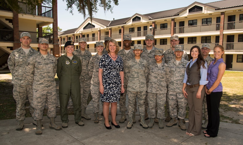 Secretary of the Air Force Deborah Lee James (middle) stands with Joint Base Charleston Airmen May 6, 2014, at the dorms on JB Charleston, S.C. James is the 23rd Secretary of the Air Force and was appointed to the position Dec, 20, 2013. She is responsible for the affairs of the Department of the Air Force, including organizing, training, equipping and providing for the welfare of its more than 690,000 active-duty, Guard, Reserve and civilian Airmen and their families. (U.S. Air Force photo/ Airman 1st Class Clayton Cupit)
