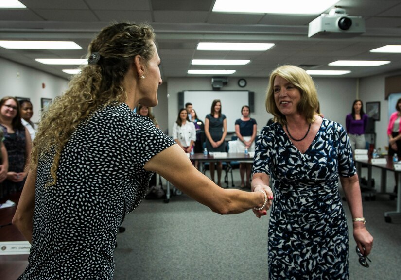 Secretary of the Air Force Deborah Lee James is greeted by Dani Fontanella, wife of Col. James Fontanella, 315th Airlift Wing commander May 6, 2014, at Joint Base Charleston, S.C. James is the 23rd Secretary of the Air Force and was appointed to the position Dec. 20, 2013. She is responsible for the affairs of the Department of the Air Force, including organizing, training, equipping and providing for the welfare of its more than 690,000 active-duty, Guard, Reserve and civilian Airmen and their families. (U.S. Air Force photo/ Senior Airman Dennis Sloan)